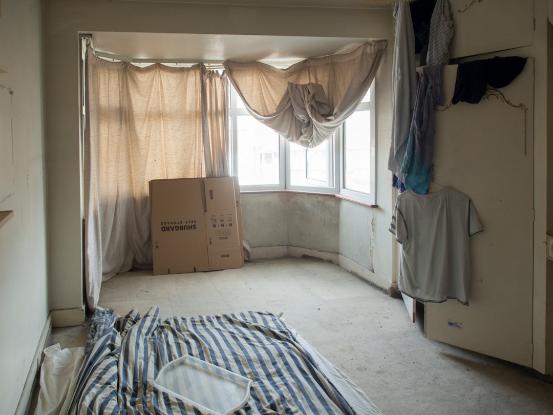 An empty room with a box on the floor